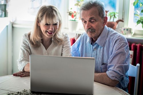 couple shopping for life insurance on computer